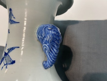 A Chinese blue, white and copper red vase with elephant handles, 19th C.